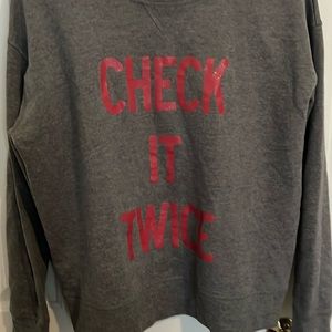 Victoria’s Secret sweatshirt size large says check it twice
